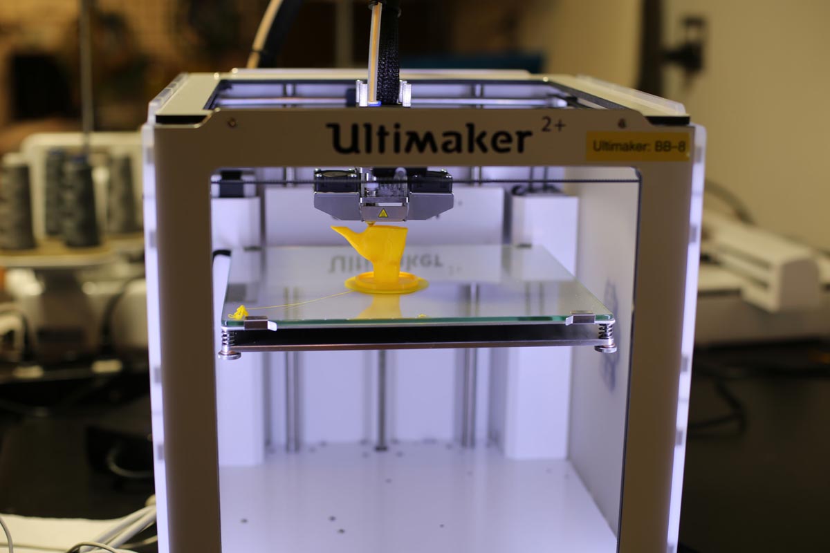 a 3D printer half way through a print job of a hand